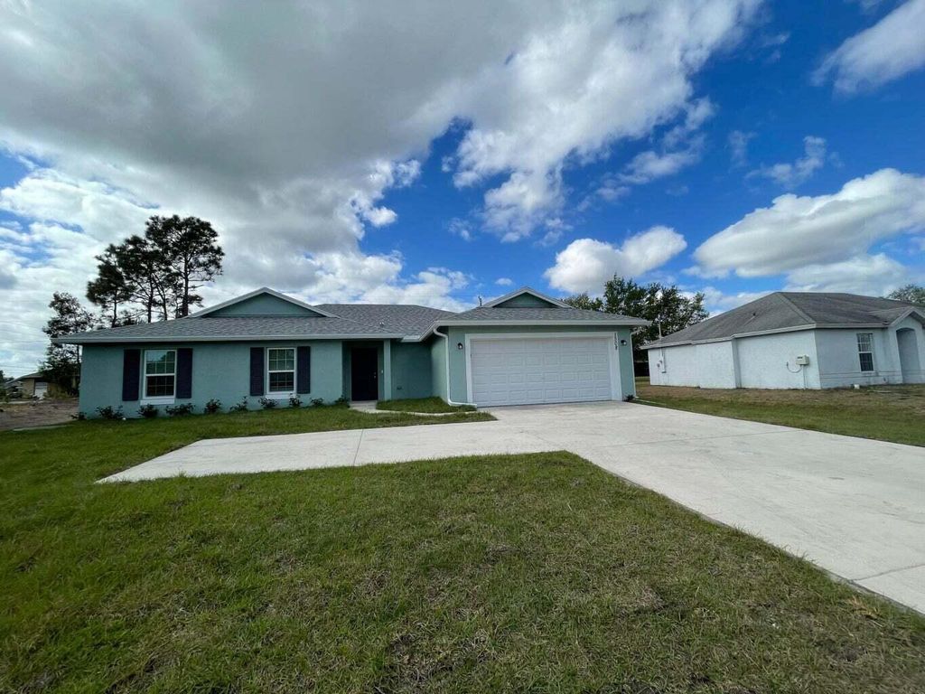 Photo of 1508 SW California Boulevard, Port Saint Lucie, FL 34953 (MLS # R10985171)