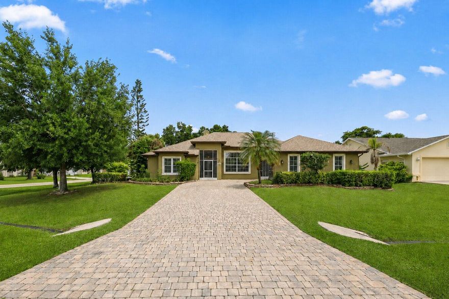 This is the one you've been waiting for - a rare opportunity to own a spacious single-family home on a generous quarter acre corner lot, right in the heart of Port Saint Lucie. Offering over 2,300 square feet of living space, this 4-bedroom home is loaded with value and ready for you to move right in. Enjoy peace of mind with all major systems recently updated: new roof, newer A/C, and newer water heater. The entire home is hurricane protected, offering both security and insurance savings. Step inside and feel instantly at home in the light-filled interior, where natural light pours in and highlights the tall vaulted ceilings throughout the home and open views of the expansive screened-in patio and pool area. The cozy, partially covered, and screened-in patio offers the perfect spot to relax or entertain while overlooking the inviting pool that is sure to be enjoyed on those Florida hot and sunny days.  Additional highlights include a 2-car garage, generous size driveway, excellent curb appeal, and a layout designed for comfortable living.  All of this in an unbeatable location less than 5 minutes to I-95, major grocery stores, and within walking distance to local restaurants, shops, and everyday conveniences.  Don't miss this move-in ready gem - schedule your private tour today!