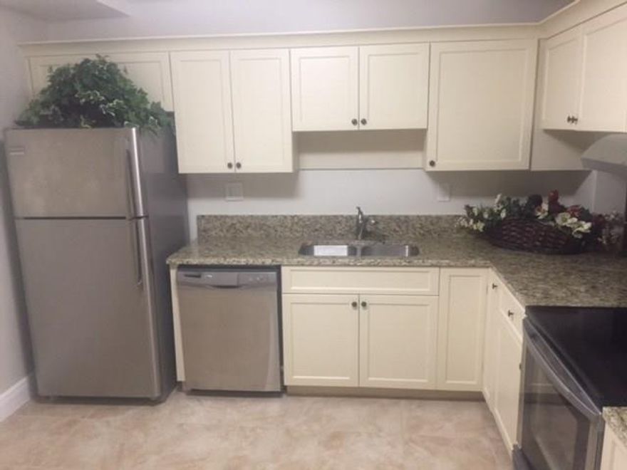 PRICED BELOW MARKET VALUE TO SELL!! Be the first to live in this REMODELED UNIT. You'll love the large laundry room with W/D, cabinets, plenty of storage. New tile & wood floors & baseboards. New A/C w/ 10 yr warranty, freshly painted, stainless steel appliances, granite counter tops.Overlooks beautiful lake with a screened in patio.  Unit is steps to elevator.  Sought after 55+ community w/ full amenities. Can rent after 6 months Maintenance includes cable, water, insurance. Credit score of 680+ required