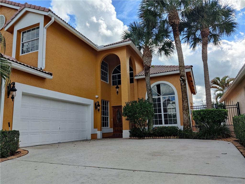 Beautifully upgraded and meticulously maintained, this rare offering in the sought-after Lakes of Boca community features 4 bedrooms, 2.5 bathrooms, and a 2-car garage. The open-concept design boasts a spacious kitchen with stainless steel appliances, soaring vaulted ceilings, oversized bedrooms with walk-in closets, and stunning lake views. Enjoy a fully fenced backyard perfect for entertaining or relaxing in total privacy. Just steps from the clubhouse with resort-style amenities including a fitness center, pool, playground, and tennis courts. Quick association approval makes this home move-in ready!