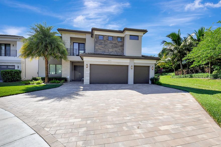 Gorgeous 2 Story Pacifica Model located in LOTUS, Boca Raton's most sought after community,  situated on a prime, cul-de-sac lot with massive driveway, 3-Car custom design garage, specialty floor & cabinetry. Interior upgraded with luxury vinyl throughout entire house, including all closets, custom glass stair rail, designer lighting & ceiling fans, beautiful built-in closets. Fully upgraded kitchen, Wolfe, subzero, & Bosch appliances, Upgraded countertops & cabinetry.Master Bedroom is on ground floor with freestanding whirlpool bathtub. 2nd Floor Loft converted to movie theatre room.  Outdoors perfect for entertaining; heated swimming pool, jacuzzi & sun shelf, custom design luxury outdoor kitchen with Hibachi, motorized screens, awnings & whole house generator. Furniture negotiable.