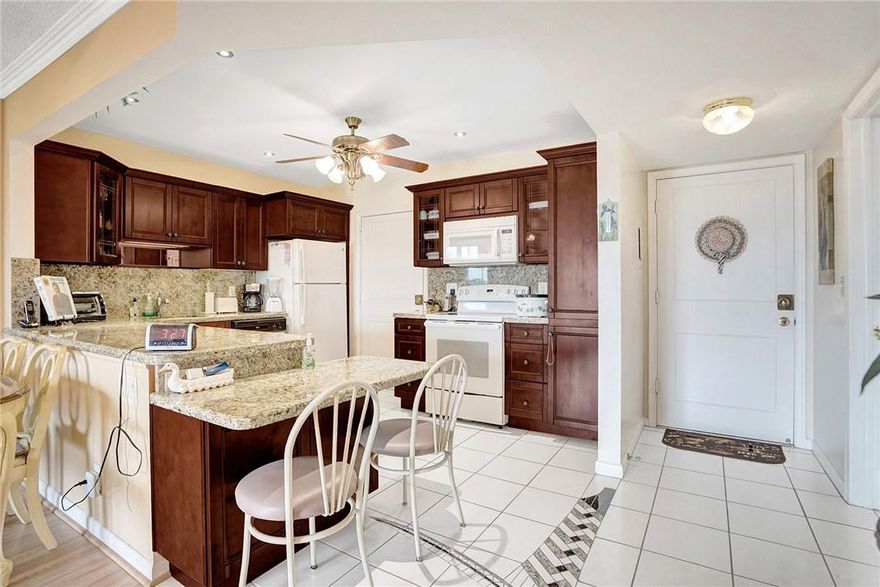 BEAUTIFUL ALL REMODELED CONDO IN CASTLE GARDEN BUILDING 14, OPEN KITCHEN WITH WOOD CABINETS AND GRANITE COUNTERTOP.  JUST SIT ON YOUR BALCONY AND ENJOY THIS BEAUTIFUL VIEW AND FLORIDA WEATHER.  UNIT IS BEING SOLD TURN KEY.  LOTS OF ACTIVITIES, LARGE CLUBHOUSE, WITH POOL, BOWLING, SHUFFLEBOARD AND LOT MORE.  ASSOCIATION SAYS 55+ COMMUNITY.