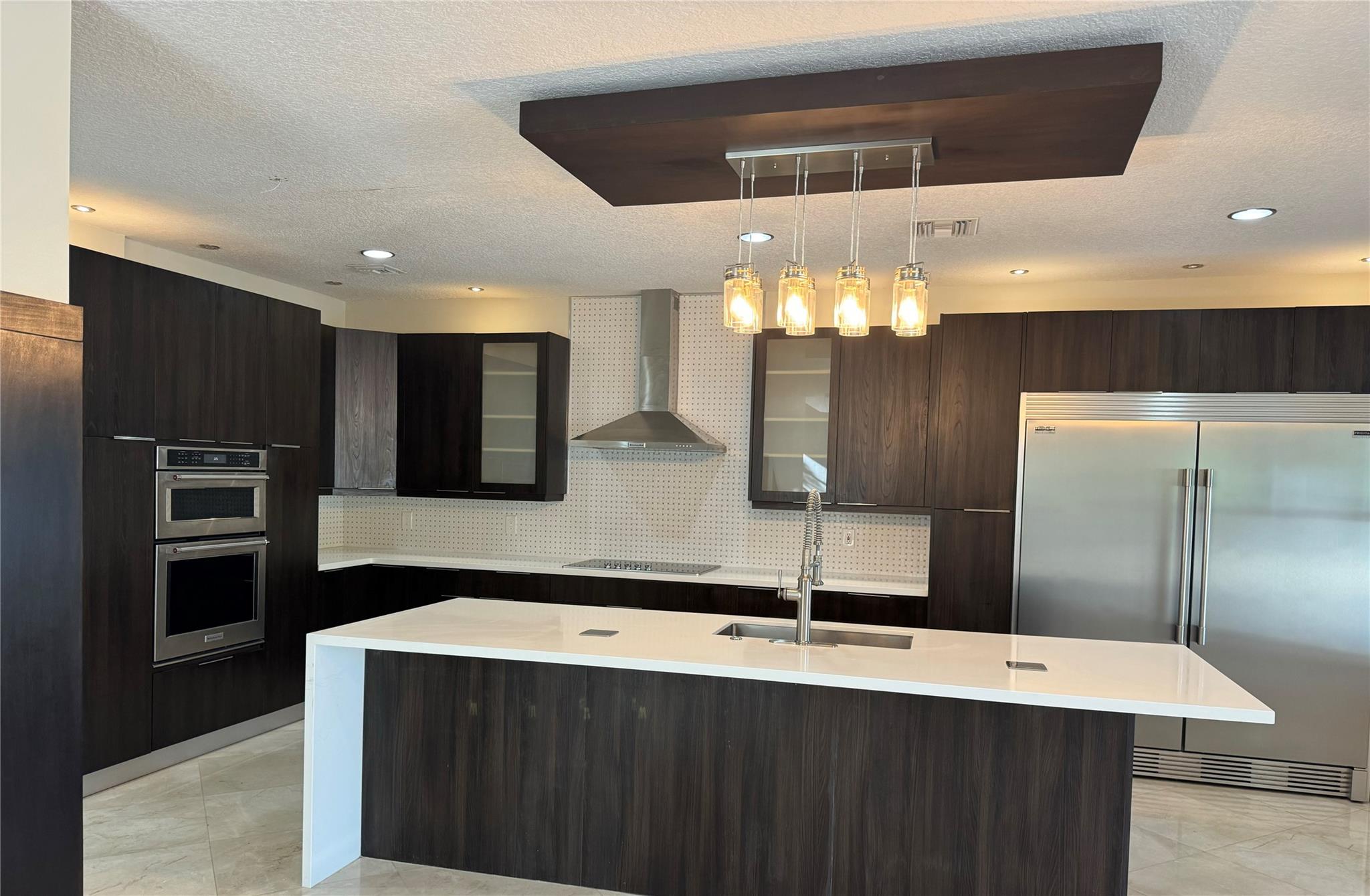 Your new home in Parkland in a gated community, beautiful kitchen with premium, almost-new KitchenAid appliances, marble floors on the first floor and laminated bamboo on the second floor, screened pool with spa, and accordion shutters. Vacant and Ready to Move In.