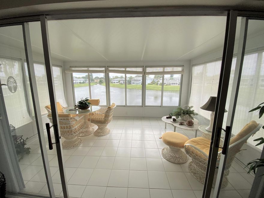 PINES OF DELRAY WEST. Choice LAKEFRONT location with sweeping water views! This fully furnished 2nd floor 2 bedroom - 2 full bath condominium has 1167 sqft under air PLUS a 160 sqft screened & tiled patio. This rebuilt patio features full sliding glass door access from the living room with 7 sets of 62 inch tall slider windows. Plus there are  IMPACT GLASS windows throughout as well as hurricane impact accordion shutters at the sliding glass doors. Other features include a 2015-installed 2-ton/14 seer Rheem AC system & ProLiaq thermostat with all replaced ac ductwork in attic; a  2017 30-gallon Rheem hot water heater; and a 17 ft long white tiled eat-in kitchen boasting all white cabinetry, granite counters and  6''x 6'' tile backsplash.  At least 1 occupant must be 55+; co-occupants 18+. WELCOME TO THE PINES OF DELRAY WEST!

The Pines of Delray West is a vibrant condominium community of 288 units within 42 buildings. It was built on 30+ acres (including a lake) in 1978-1979 by Carman Development LTD and is within the city limits of Delray Beach-  located just off the northwest corner of Homewood Blvd and Linton Blvd. Only 12 of the 42 buildings--including the one in which this listing is located -- are situated on the lake. And only 3 of the 12 buildings on the lake -including the one in which this listing is located- look down the full length of the lake!

At least one approved buyer must be me at least 55 years of ago. And approved co-occupants must be at least 18 years of age. Occupants under the age of 55 can only reside on the premises if at least one 55+ occupant is in residence at the same time. Persons under 18 years of age are allowed to stay as a guest for up to 30 days per calendar year.

People at the Pines of Delray West are very friendly,  there are lots of things to do and the grounds look great. The community includes a clubhouse, a 60' x 30' heated pool, an exercise room, a library room, and a community room. Sports activities include bocce ball, pickleball and tennis. INCLUDED in your 2022 monthly condo fee of $395 are fully funded reserves, water & sewer and basic cable. AND starting August 1st  fiber optic cable, high definition service AND in-unit WIFI will also be included. The condo fee also covers roof repair and replacement, exterior painting, parking area paving and all lawn care services. Building insurance is included, but you should get (as it is not mandatory) your own so-called HO-6 "walls-in" homeowners insurance policy.

SORRY, but-- pets- trucks- vans -campers- recreational vehicles- boats- golf carts- limousines- motorcycles and vehicles with exterior signage are not permitted. And a unit must be owned for 18 months to be eligible to be leased out and then the lease must be for a 4-month minimum and only one lease is allowed per each 12 month period
 
And unlike some other nearby condominiums NO special assessments are in effect or pending. And there is NO new owner capital contribution fee, NO clubhouse renovation fee/building fund,  NO recreational lease and NO special time restrictions as to when your guests can use the clubhouse, exercise equipment or swimming pool.

The Pines of Delray West is conveniently located with easy access to I-95 and only a 2.5 mile drive to the Atlantic Ocean and beach parking. It is also only 3.5 miles from the widely popular "downtown Delray Beach" with its 80+ restaurants, taverns and coffee shops. The Pines of Delray West is around a 30 minute drive to either Palm Beach International Airport or Fort Lauderdale/Hollywood International Airport via I-95 (except during rush hour)

South Florida's professional sports teams- the Miami Dolphins, the Miami Heat and the Florida Panthers - all have arenas in either Broward or Dade County. South Florida also has three NCAA Division 1 college football & basketball programs - namely the University of Miami Hurricanes, the FIU Panthers and the Florida Atlantic University Owls. Only the Florida Atlantic Owls are in Palm Beach County and play at a stadium in Boca Raton. Although there is one poker room (60 tables) in Palm Beach County, full casinos, slot parlors and horse racing are prohibited.  However, there are 8 casinos in nearby Broward County - most of which prohibit smoking.
 
NOTE: The above information is not warranted nor guaranteed as 100% accurate. It is subject to inadvertent error, omission, miscalculation and misinterpretation. Prospective buyers need to independently verify the accuracy of the information presented.