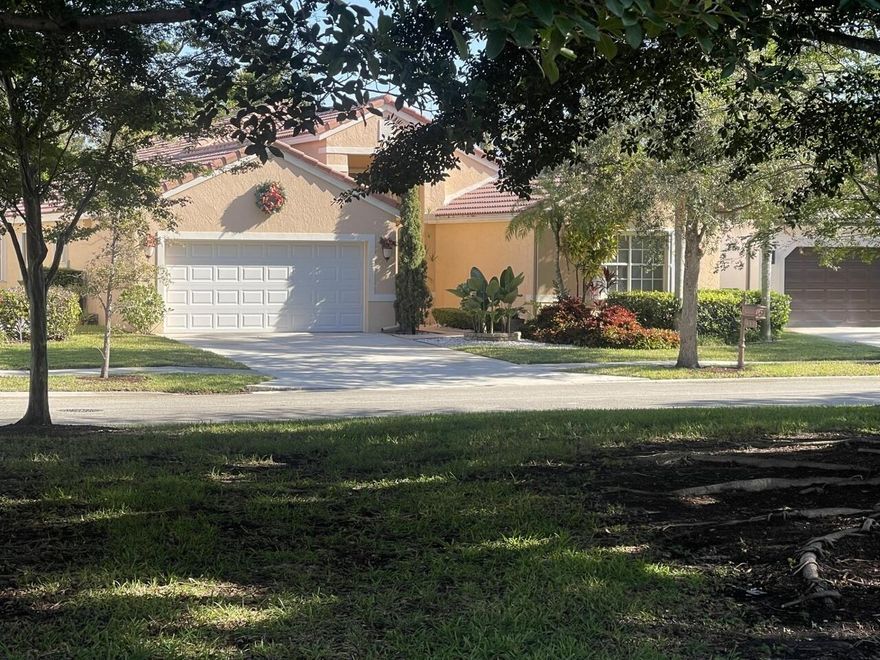 Rare opportunity in highly sought-after Western Lakes! This 4BR/2.5BA single-story home sits on a quiet private street with premium water and park views. Features include laminate flooring throughout, a spacious layout, and a boarded attic for added storage. Enjoy a screened-in pool and spa with LED lighting, perfectly positioned for ideal sun exposure. Full hurricane protection with accordion shutters throughout. Two-car garage plus ample guest parking. Guard-gated community with soccer field, pool, and playground. Walk to shopping, dining, and daily conveniences. Homes like this don't last—schedule your showing today!