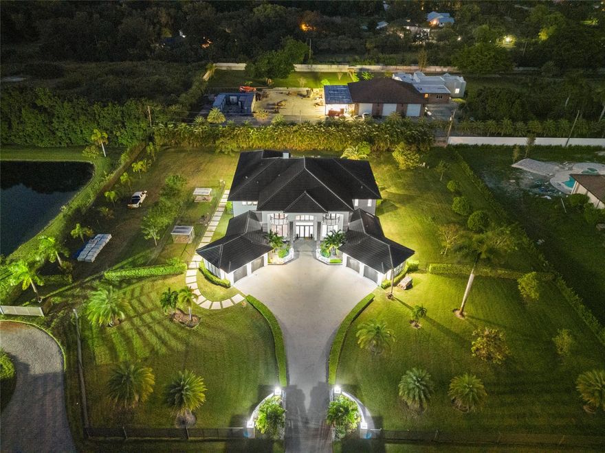 ***NEWLY BUILT IN 2021,THIS MODERN CONTEMPORARY ESTATE IS LOCATED IN THE HEART OF SUNSHINE RANCHES!!!***BOLD AND STATELY ON NEARLY 2 ACRES,THIS SECLUDED ENCLAVE OF ONLY 3 HOMES IS TUCKED AWAY & HIDDEN W/I PLAIN SITE. TOTALING 10,695 SF,MAIN LIVING AREA 7,560 SF,OFFERS 6 BEDRMS+OFFICE,7.5 BATHS,W/4 CAR GARAGE. CONTROL 4 SMART HOME W/ACCESS FROM YOUR PHONE. TWO-STORY TRIPLE SPLIT FLR PLAN W/IMPRESSIVE RMS SIZES &THREE BONUS RMS FOR THE FULL FAMILY EXPERIENCE. DESIGNER MODERN KITCHEN W/ S/S STEEL APPLIANCE PACKAGE,WALK-IN PANTRY,EXTRA CABINETS,QUARTZ COUNTERS. GRAND FOYER ENTRY W/SOARING 24' COFFER &DECORATIVE CEILINGS,CROWN MOLDING,ACCENT LIGHTING,LED LIGHTS THRU-OUT. 4’X2' MARBLE FLING IN SOCIAL AREAS &WOOD FLRS IN ALL BEDRMS. RESORT STYLE 40’X40’ HEATED, SALT POOL W/JACUZZI &TANNING SHELF.