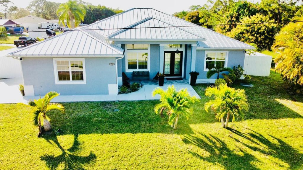 Photo of 2092 SW Airoso Boulevard, Port Saint Lucie, FL 34984 (MLS # R11152990)