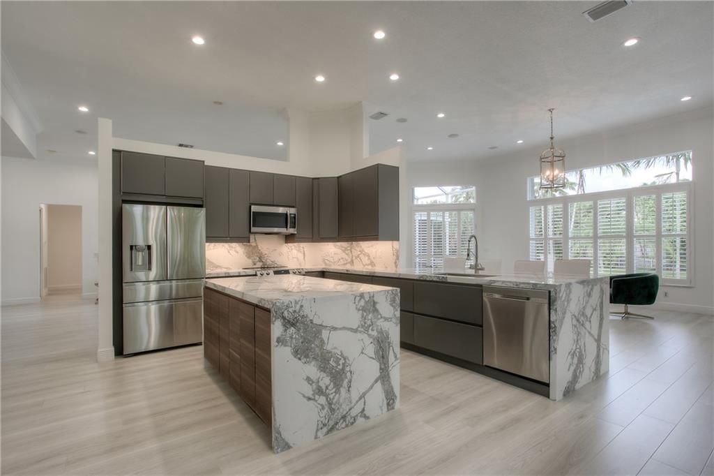 Photo of 317 Windmill Palm Ave, Plantation, FL 33324 (MLS # F10290288)