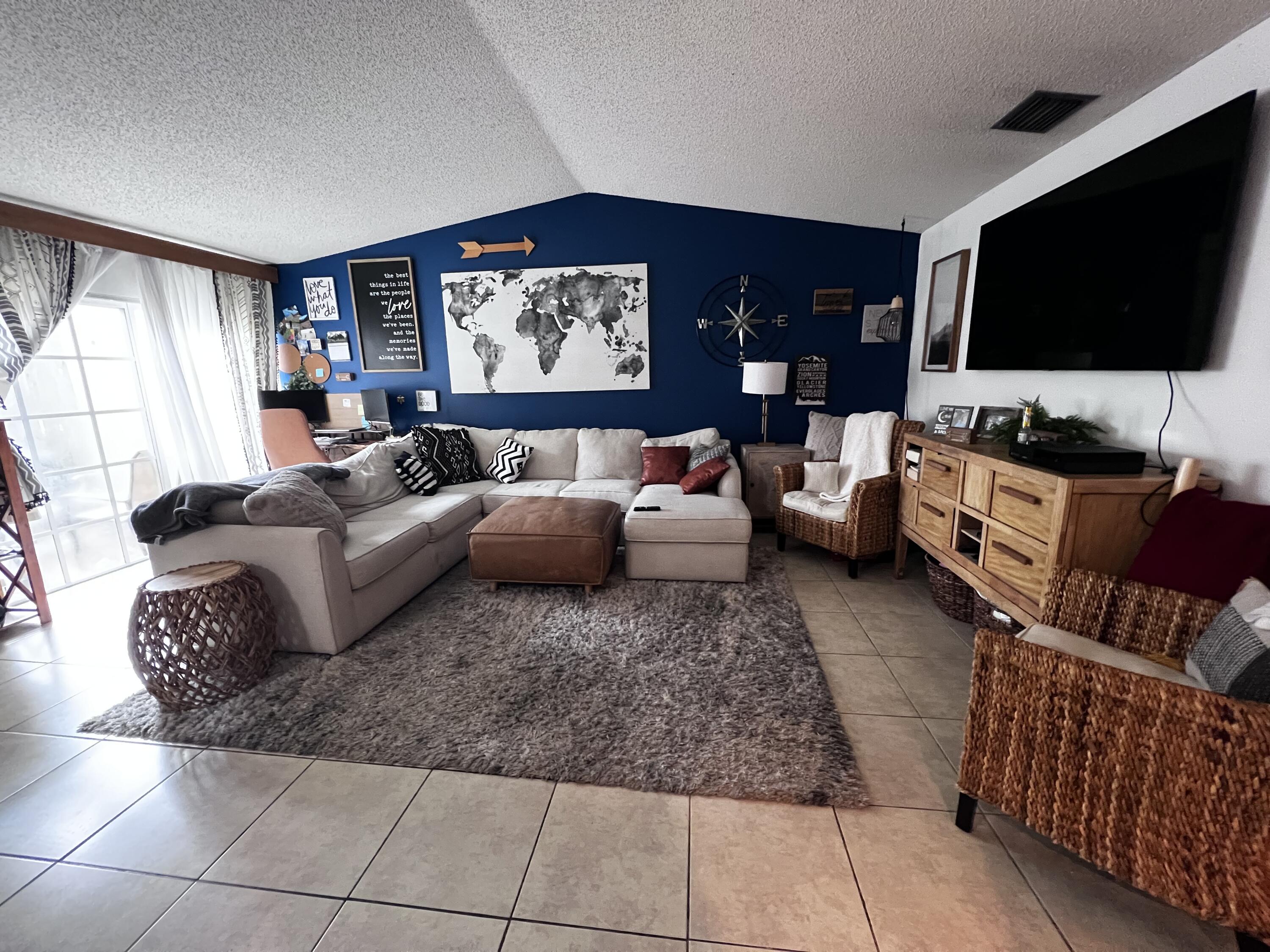 Modern Comfort & Prime Location. A beautifully maintained 2-bedroom, 2-bathroom apartment offering comfort, convenience, and style in one of Palm Beach County's most desirable communities. Property Features:Open-concept living and dining area with abundant natural light, Updated kitchen with stainless steel and smart appliances and ample cabinet space, generously sized bedrooms with large closets, In-unit washer and dryer for added convenience, Private front and back patio perfect for morning coffee or evening relaxation, Central A/C , Assigned parking space included, Pet-friendly (with restrictions), Impact proof doors for added convenience, smart ac thermostat for increased energy efficiency.