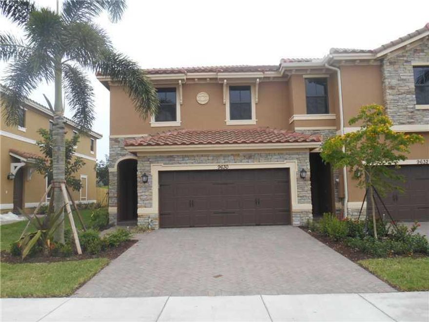 Beautiful Town Parc at Mira Lago, 3 Bedrooms, 2.5 baths, 2 Car garage, end unit, crown molding, framed mirrors, fans, lighting and stainless steel backsplashand appliances, great neighborhood with excellent A rated schools, tastefully upgraded, impact win dows and doors, keyless entry, private back yard larger than most. Tile downstairs, upgraded cabinets, granite, laundry upstairs. Enjoy the Parkland Lifestyle and A rated schools. Gated with pool.