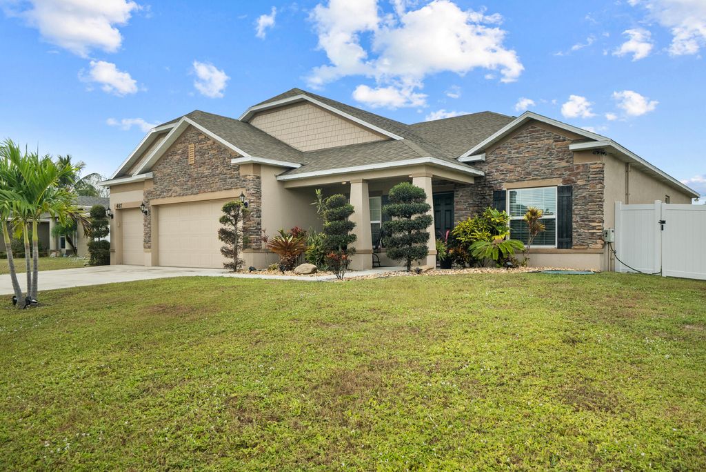 Photo of 487 SW Feldman Avenue, Port Saint Lucie, FL 34953 (MLS # R10937009)