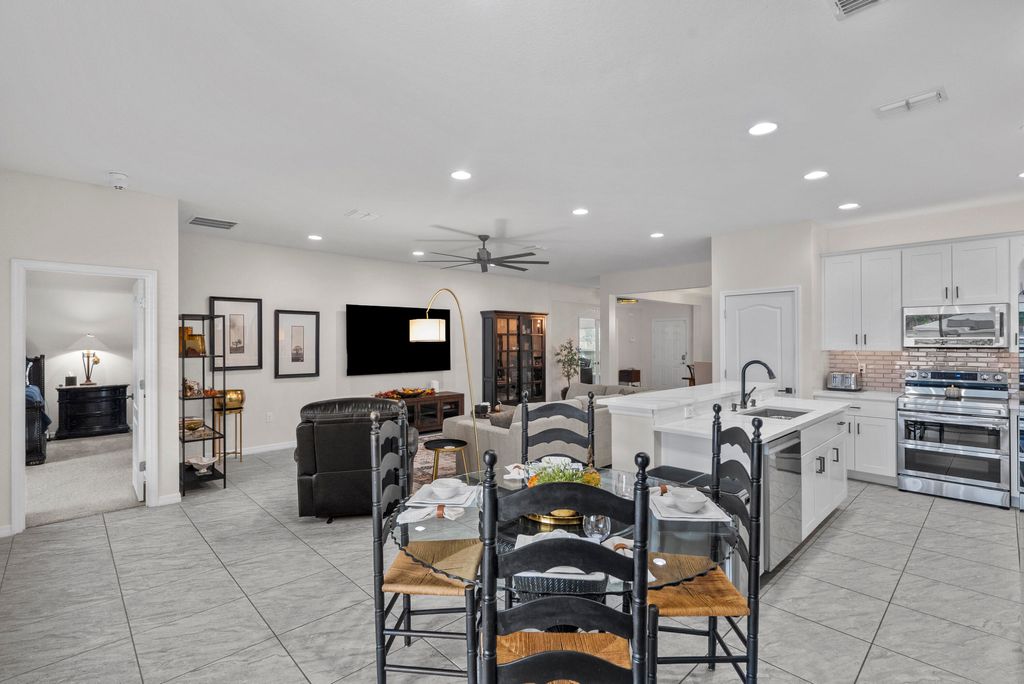 Photo of 487 SW Feldman Avenue, Port Saint Lucie, FL 34953 (MLS # R10937009)