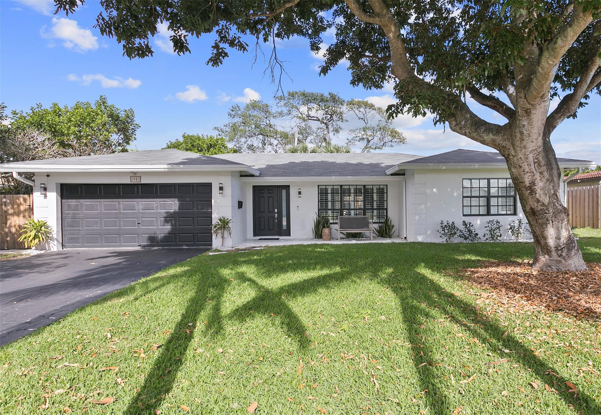 Perfectly situated, beautiful furnished 3 bedroom, 2 bathroom home in the heart of prestigious Lighthouse Point. This incredibly spacious and bright split floorplan home, offers an inviting, open kitchen, an additional family room, a separate laundry room and a primary suite with an oversized bathroom and two sinks. The backyard impresses with a relaxing heated pool, hot tub, newly placed turf grass, new fencing, a firepit, covered tiki hut, and barbecue. The home has all new plumbing, new beautiful wood-looking tile throughout a new hot water heater, 2 new AC's, a new fridge, dishwasher, disposal. Impact windows through out. A two car garage. Just moments to the Lighthouse Point Marina, the Lighthouse Point Yacht Club, two beautiful parks and playgrounds.