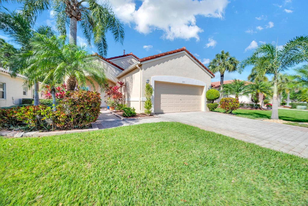 Photo of 320 NW Alana Avenue, Port Saint Lucie, FL 34986 (MLS # R11066137)