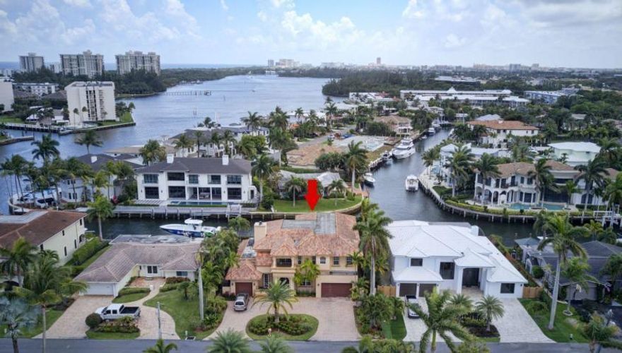 Bring your 85 ft Yacht and walk to Spanish River Beach.3 Houses from Intracoastal with great Intracoastal View's  and South facing in the rear. This  Deepwater Boca Estate has wide open water views because it sits on two intersecting canal's for great long water views and easy Yacht turning. Downstairs mother-in law or guest suite or used as a down stairs master.  All bedrooms are on suite with an upstairs  grand Master suite featuring wide water and Intracoastal views.