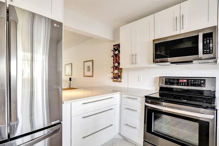 REDUCED TO SELL! DO NOT MISS OUT! Completely updated 2 bedrooms, 2 bathrooms 1st floor condo. Updated modern open kitchen. White cabinets.  Quartz counter tops. Large Pantry. Stainless appliances. 2 Updated bathrooms w/ a charming touch. New vanities, new toilets tiled showers. Spacious bedroom w/ large walk-in closet. New doors. Custom Murphy bed in front bedroom. Washer & Dryer. A/C 2021. Newer water heater. Tile flooring & high end carpet in main bedroom. Enjoy a nice screened patio w/ tropical landscaping for privacy. Welcome to Independence Bay active all age community. 24/7 gated. Heated pools, Clubhouse, Tennis, community room. Gym. Kids Playground. BBQ. Boat dock available. Well maintained community. Great location minutes to shopping, restaurants & Deerfield Beach.  MUST​​‌​​​​‌​‌​​​‌‌​​​‌‌‌​​‌​​‌‌​​​​ SEE!
