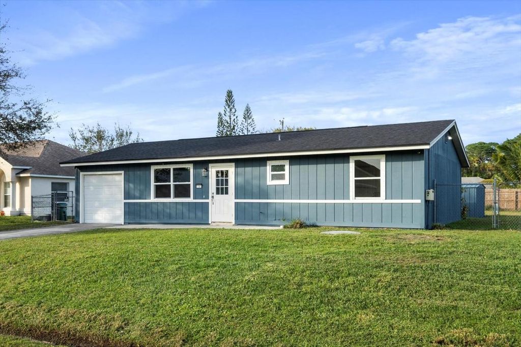 Photo of 1161 SW Coleman Avenue, Port Saint Lucie, FL 34953 (MLS # R10951396)