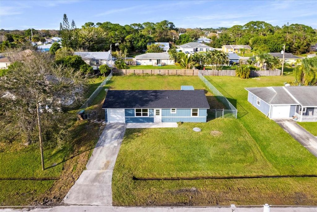Photo of 1161 SW Coleman Avenue, Port Saint Lucie, FL 34953 (MLS # R10951396)