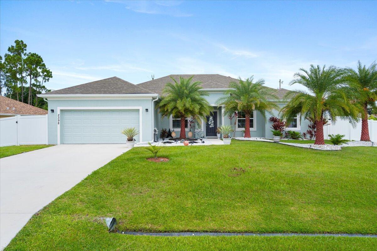 Welcome to your forever home! Built in 2022, this beautifully designed and decorated 4-bedroom, 3-bath residence with a versatile den offers modern comfort and style in one of the most convenient locations near Tradition, without the higher taxes and community expenses. Enjoy your own private oasis with a heated pool, lush tropical landscaping, and a fully fenced backyard with durable 6-foot PVC fencing--perfect for relaxing or entertaining. Inside, you'll find an open-concept layout featuring granite countertops, stainless steel appliances, and elegant finishes throughout. Ideally situated near I-95, premier shopping, dining, entertainment, and Cleveland Clinic's top-rated medical facilities, this home blends luxury living with unbeatable accessibility. Don't miss this opportunity!