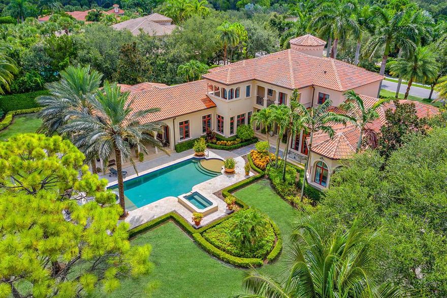 HOME IS VACANT easy to show  Grand Estate in Old Palm Golf Club with gorgeous panoramic views located on the 1st hole.  This home boasts the finest craftsmanship & state-of-the-art features with  5 bedrooms 6 ½ full baths an elegant powder room, gourmet-chef's kitchen, wine cellar, home theater, imported Italian stonework, wainscoting, and gilded crown molding and generator.  A first floor master suite is thoughtfully paired with his/hers separate baths and custom closets.  A wonderful covered loggia with fireplace and summer kitchen for entertaining and enjoying the Old Palm Lifestyle with walking distance to the club house.