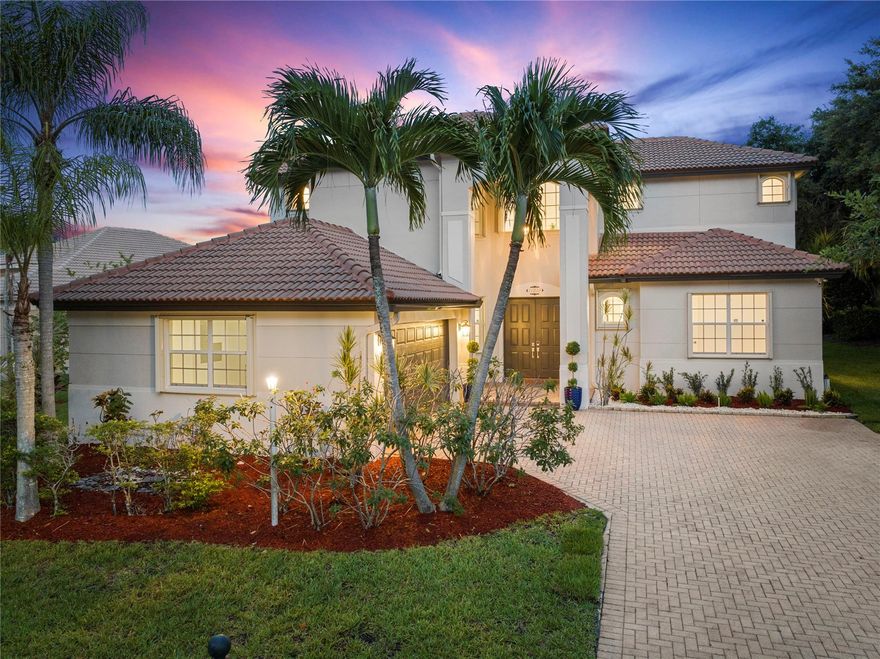 Stunning Former Builder Spinnaker Model w/5 Full Beds, 3/5 Baths Waterfront 1/3 Of An Acre, Corner Lot!  Marble Floors Downstairs, 2006 Roof, Screened-In Patio & Spacious Extended Pavered Patio w/Fenced-In Yard, Freshly Painted Interior! Gourmet Kitchen w/Stainless Steel Appliances, Granite Counters, LED Lighting,Updated Upstairs Baths w/Marble Tile,Primary Bed w/Sitting Area Downstairs,Walk-In Closets, Another Full Bed Downstairs, Updated Laminate Floors On Stairs & Upstairs, Jack & Jill Beds & Bath, Separate On-Suite Bed & Bath. Tesla Charger in Garage. Walk To Resort-Style Clubhouse w/Heated Swimming Pool & Spa,Fitness Center, Tennis & Pickleball Courts, 24-Hour Guard Gate, Low HOA Dues Includes Comast High-Speed Internet & Basic Cable, ADT Alarm, 24-Hour Guard Gate, Walk To A+ Schools!