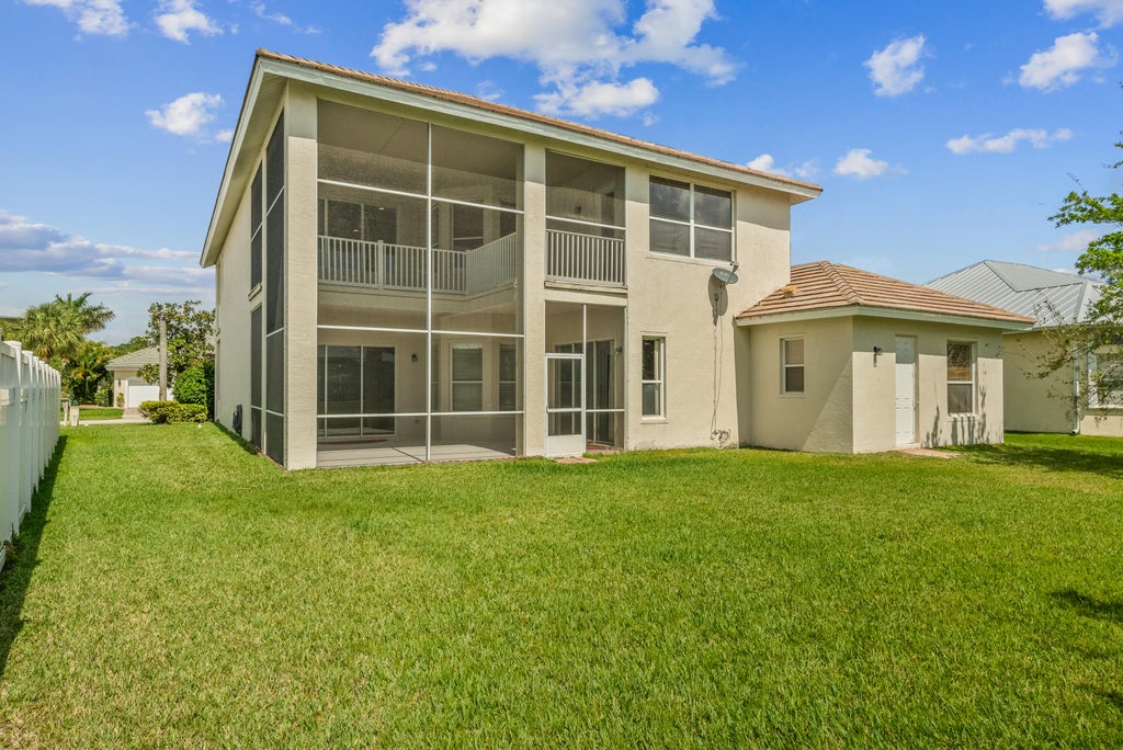 Photo of 206 NW Magnolia Lakes Boulevard, Port Saint Lucie, FL 34986 (MLS # R11030614)