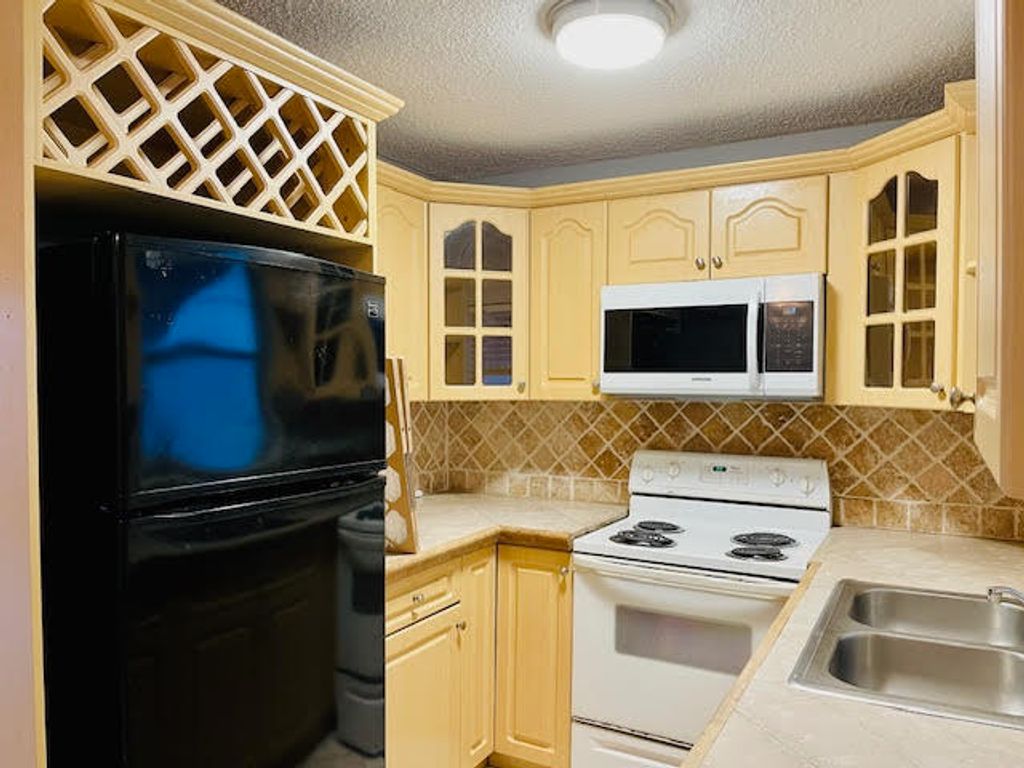 Photo of 4491 NW 1st Terrace, Deerfield Beach, FL 33064 (MLS # R11093864)