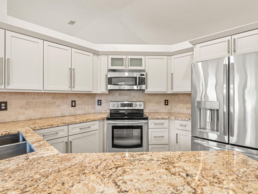 Beautifully maintained 4BR/2.5BA single-story home on a prime corner lot in Orchid Island. Bright, open layout with vaulted ceilings throughout the main living areas. Major upgrades include brand new luxury vinyl flooring throughout and freshly painted kitchen cabinets, giving the home a modern, move-in ready feel. Kitchen also features granite countertops and stainless steel appliances. Beautifully renovated bathrooms. Enjoy outdoor living with a large patio and sparkling pool—perfect for entertaining. Additional features include accordion shutters and a newer A/C (less than 2 years old). Corporate relocation.