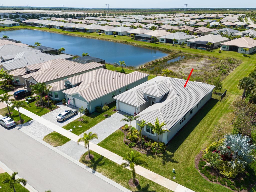 Photo of 11950 SW Laguna Bay Parkway, Port Saint Lucie, FL 34987 (MLS # R10973846)