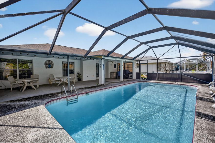 Located in the desirable Southbend Estates neighborhood of Port St. Lucie, this 3-bedroom, 2-bath pool home with a 2-car garage offers the perfect blend of space, flexibility, and Florida lifestyle. The open kitchen sits at the center of the home, overlooking the family room and the expansive 41' x 12' covered porch and screened pool area, ideal for entertaining or relaxing year-round. Formal living and dining rooms provide additional space and could easily be converted into a 4th bedroom, office, or playroom. Enjoy outdoor living in the private backyard with a large covered patio and pool. Southbend residents love the nearby Jessica Clinton Park featuring a public boat ramp with ocean access, ballfields, soccer fields, playground, and picnic areas. Convenient to FL Turnpike for commute.