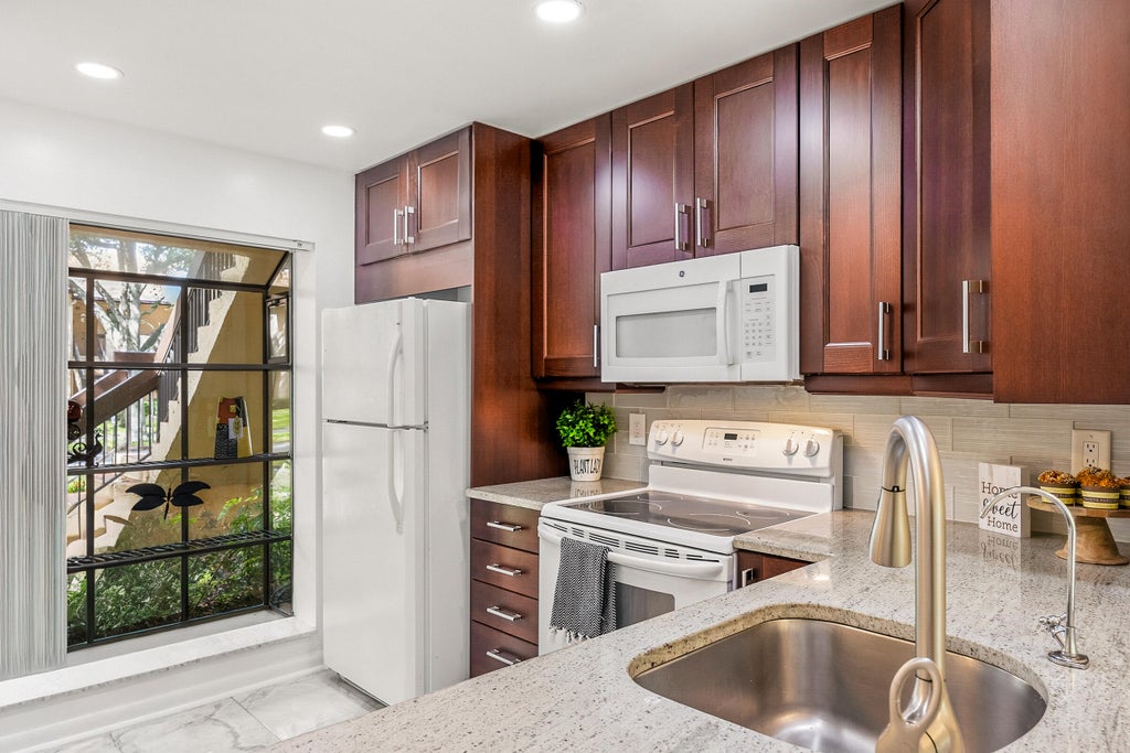 Photo of 2225 SW 15TH Street #223, Deerfield Beach, FL 33442 (MLS # B26093346)