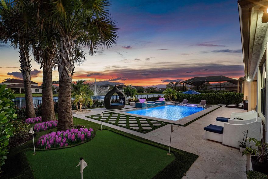 Luxurious Lakefront Living in Sonoma Isles Jupiter. Welcome to a breathtaking ''Garden Vista'' model home situated in the prestigious gated community of Sonoma Isles in Jupiter. This exquisite residence, built in 2021, offers 4,287 square feet of thoughtfully designed living space, featuring 5 bedrooms, 4.1 bathrooms, a private office, a spacious loft, and a stunning all-glass wine room--all nestled on a serene fountain lakefront lot. Step through the grand double-impact decorative glass entry doors into a home where modern elegance meets resort-inspired comfort. The soaring ceilings and custom designer spiral staircase, accentuated with wrought-iron railings, create a captivating first impression. The heart of the home is a chef's dream kitchen with upgraded and expansive quartz counterto