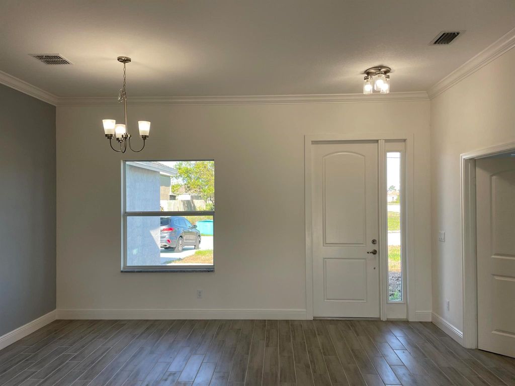 Photo of 631 SE Prineville Street, Port Saint Lucie, FL 34983 (MLS # R10923869)