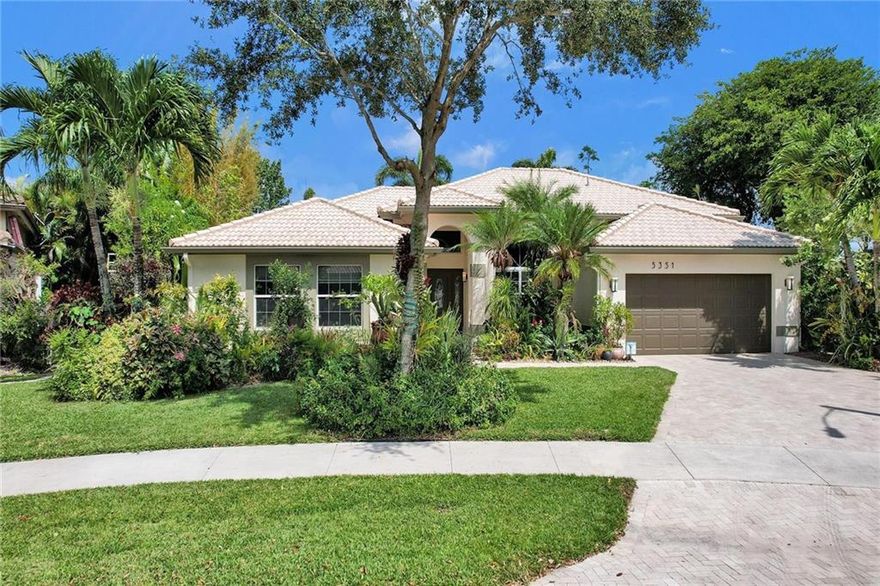 PARADISE FOUND. This spectacular property is simply the best of Florida living. With expansive lake views, this meticulously landscaped tropical oasis has the perfect balance of water living and privacy. Inside you'll find gorgeous high-end finishes, 4 bedrooms, dining area, breakfast area, living room & family room with an open kitchen perfect for entertaining. The primary bedroom features an en-suite with dual vanities, separate tub & walk-in shower that you'll never want to leave - until you walk outside. The completely screened-in patio & pool area offers more dining & entertaining opportunities. Connect with nature in the your, heated, saltwater, pool and connected jetted spa or simply walk the pathways that lead you through this truly unique property. You won't find another like it.