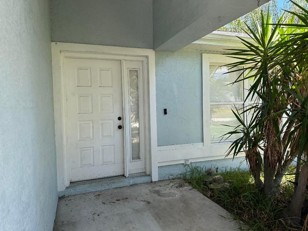 Photo of 1457 SW Glastonberry Avenue, Port Saint Lucie, FL 34953 (MLS # R10981593)