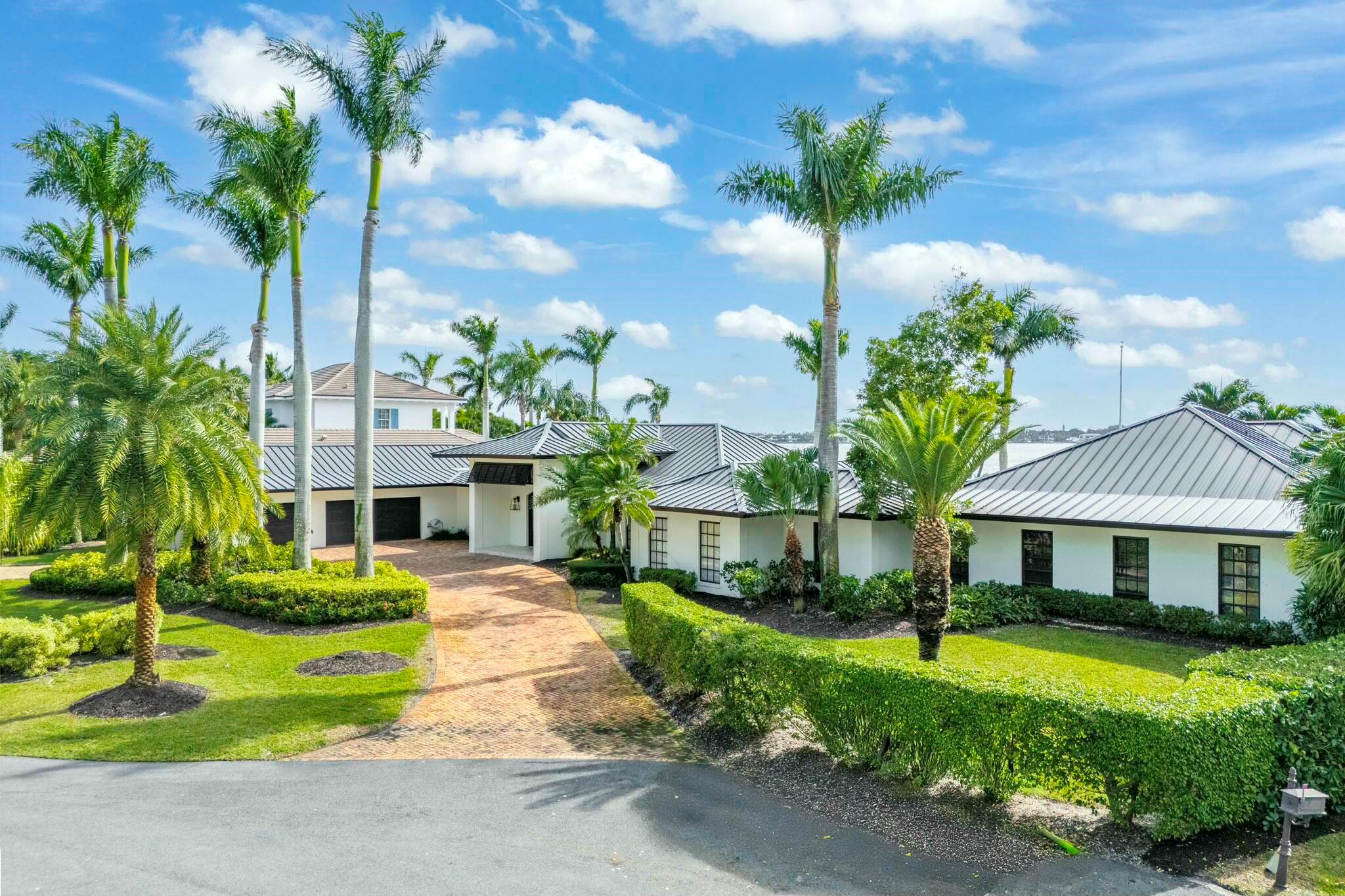 Tucked away in Tequesta Country Club, this extraordinary 193' riverfront property is a RARE FIND. Captivating panoramic, wide water sight lines from the Jupiter Inlet to Pennock Point are breathtaking. This true southern exposure offers sunrise and sunset views and is only moments from the ocean. The convenience of a 5000 sq. ft. ONE STORY home is made possible with this oversized .55 acre lot. 2 living areas, 2 dining areas, 5 bedrooms, office, family room, 5 full and 2 half baths, a 3 car garage, a covered poolside lanai, an outdoor fireplace, a full house generator, and a 16,000 lb lift. Built in 1977, updated in 2003 (plus a large addition) updated again in 2014. Plans for a second floor addition available. This is a spectacular location, on a quiet street in a lovely neighborhood.