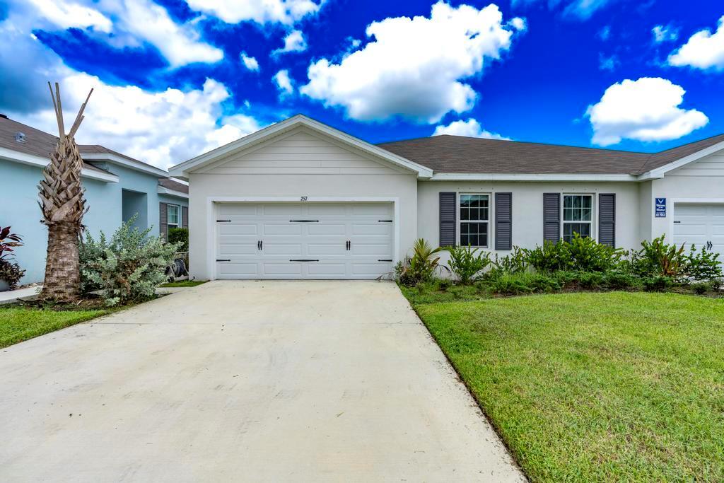 Discover this lovely 3-bedroom, 2-bath villa located in the new development of Avalon Crossing. This home boasts sophisticated features such as tile floors in main areas, granite counter tops, covered lanai, window treatments & ''Smart Home'' features. Nestled within a serene setting and at a dead end for added privacy, the villa features a two-car garage & a large backyard for outdoor enjoyment. Close to downtown Fort Pierce, beautiful beaches, & easy access to highways. Ready for immediate move-in, this home allows you to bypass the typical construction wait of 7 months. Enjoy the perks of low-maintenance HOA fees, which include access to a beautiful pool & clubhouse. Don't wait...schedule your showing today!