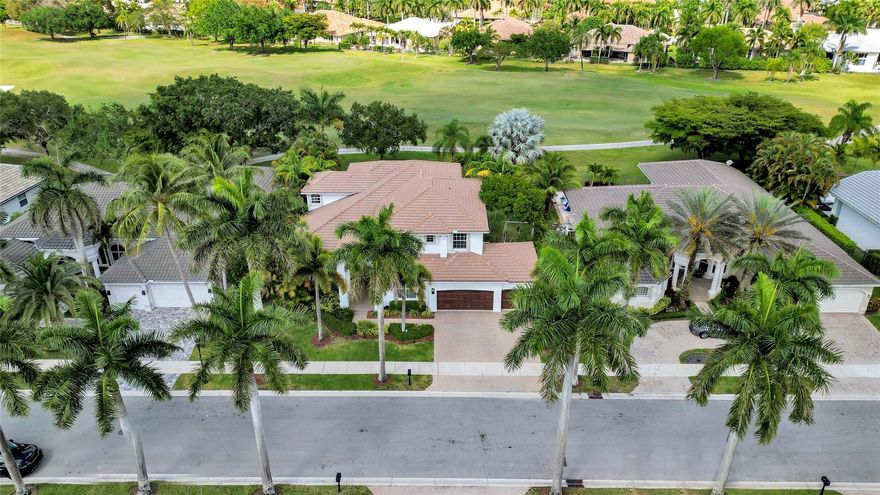 Breathtaking golf course views! The crown jewel of this stunning Weston Hills Country Club estate! Perfectly placed on an oversized lot with no neighbors behind, this home offers unmatched privacy and a front-row seat to Florida’s most serene fairways. Renovated travertine pool deck framed by lush landscaping, ideal for sun-filled afternoons or entertaining under the stars. Inside, 6 bedrooms (2 conveniently on the main floor) plus a versatile bonus room give flexibility for family, guests, or a private office. The primary suite is a retreat, with its own balcony overlooking the pool and endless greens. A gourmet kitchen with granite counters, stainless appliances, elegant wood floors, and a professionally organized garage complete the picture, where luxury, comfort, and lifestyle meet.
