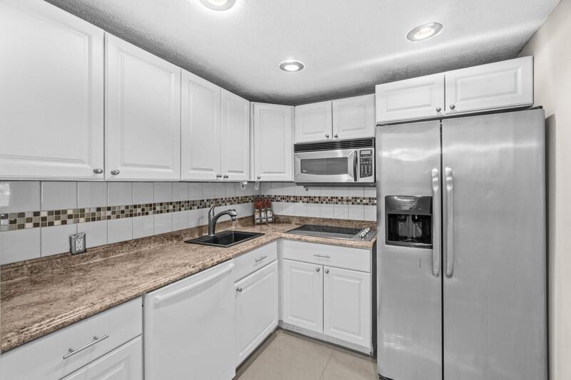 Move-in ready 1 bedroom, 1.5 bath 3rd floor apartment just steps from the elevator and laundry room in beautiful Dorset at Century Village. This unit features neutral ceramic tiling throughout the living area, an updated kitchen with granite countertops, recessed lighting, and stainless steel appliances, an updated guest bathroom, and a lovely view of the lake from the living room. Spacious screened in patio in back. Unit is clean and ready for a new owner. Century Village is a premier 55+ community with 24/7 security, a state of the art clubhouse, multiple pools, tennis, pickleball, a theater, library, arts and crafts rooms, a fitness center, and so much more.