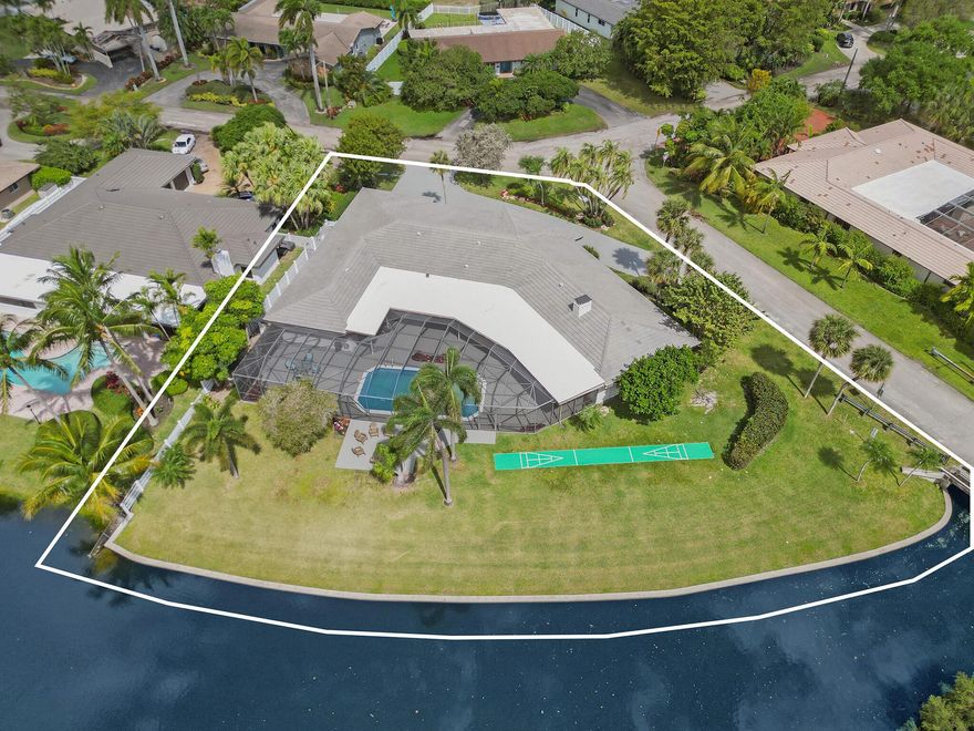 Welcome to the first-ever home built on the exclusive block of Casper Court, Emerald Hills, Hollywood, FL! This 4500 square feet gem on 26,000  square feet of land boasts a distinctive three-wing design for ultimate privacy. Indulge in stunning panoramic views of the lake and golf course from nearly every corner of the house. With 200 ft of lake frontage leading out to the intracoastal and surrounded by the picturesque Emerald Hills Golf Course, it's not just a home--it's a lifestyle. Close to many houses of worship, beaches, and attractions. Don't miss this rare opportunity to claim your slice of paradise!