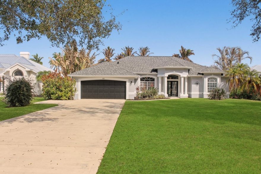 CUSTOM BUILT WATER FRONT HOME ON WIDE CANAL W/ OCEAN ACCESS-PRIVATE DOCK-ON OVER 1/2 AC LOT IN GATED COMMUNITY-SCREENED IN FREE FORM POOL, SPRINKLER SYSTEM ON WELL, AND LOW HOA FEES.