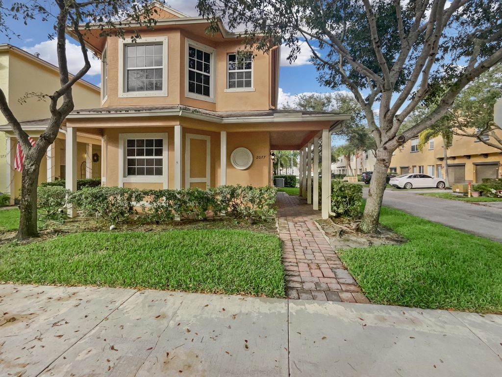 Photo of 2077 SE Fern Park Drive, Port St Lucie, FL 34952 (MLS # R10852411)