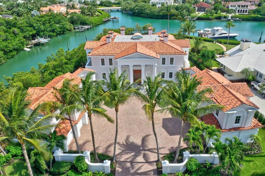 Masterful craftsmanship and lavish finishes resulted in the creation of this exceptional waterfront estate. The symmetrical design true to the principals of Palladian architecture, creates a feeling of harmony & balance in those that enter the gracious main residence. Through bright, open spaces, one can flow from the library to the dining room or through the rotunda to the gourmet kitchen, family room & club room. A grand staircase leads to the master suite with sitting room, exquisite master bath with an agate shower & private sun deck with views over the pool & grounds. The home affords many opportunities for entertaining & is complemented by two private, detached guest suites & air-conditioned garages for 6 cars. A private dock provides immediate ocean access for your yacht.