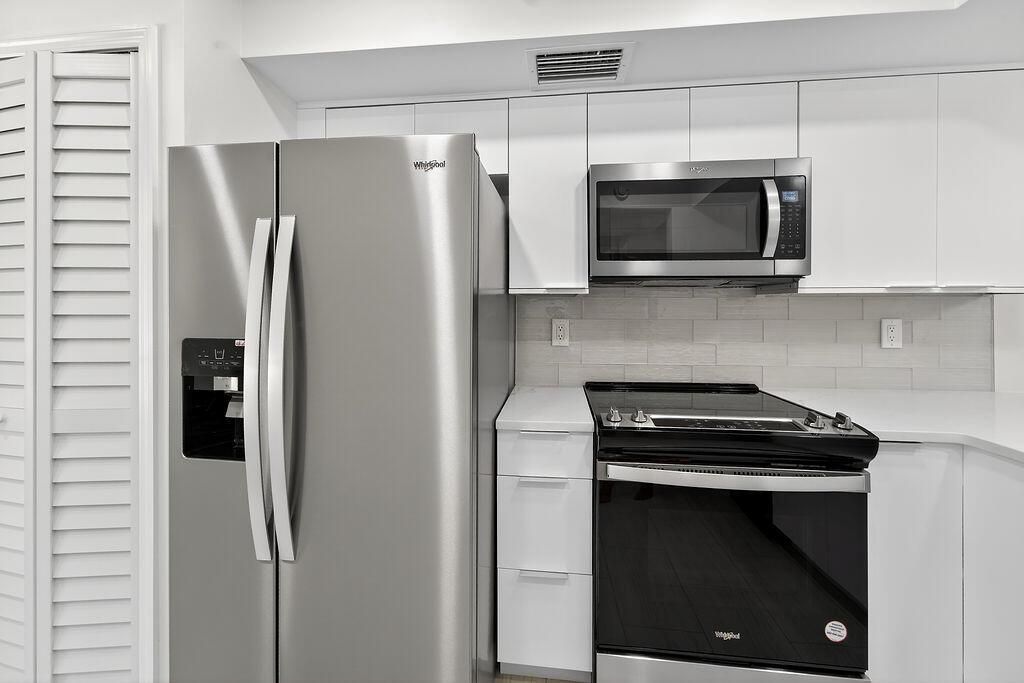 Photo of 114 Brackenwood Road, Palm Beach Gardens, FL 33418 (MLS # R11113123)