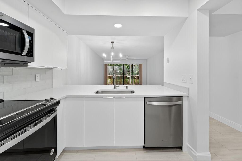 Photo of 114 Brackenwood Road, Palm Beach Gardens, FL 33418 (MLS # R11113123)