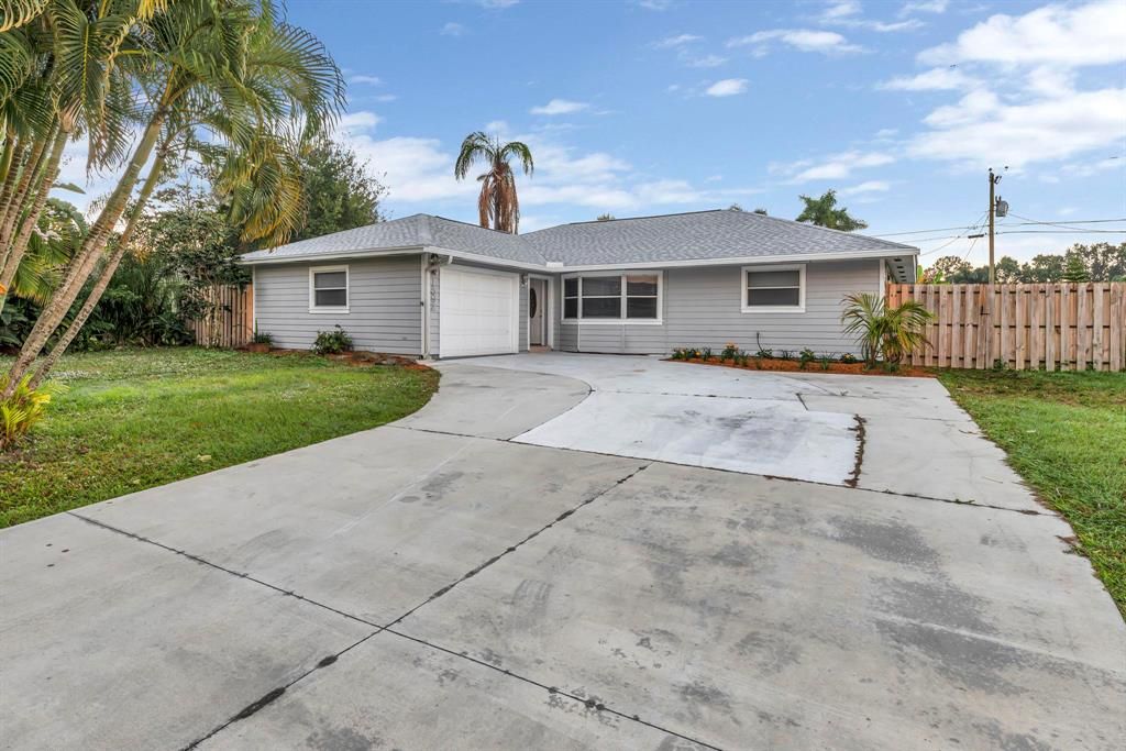 Photo of 1592 SW Aledo Lane, Port Saint Lucie, FL 34953 (MLS # R10760998)