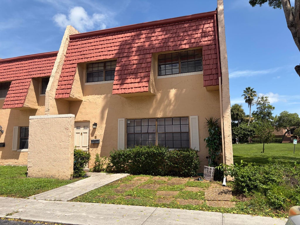 Photo of 40 SPINNING WHEEL Lane, Tamarac, FL 33319 (MLS # B26076551)