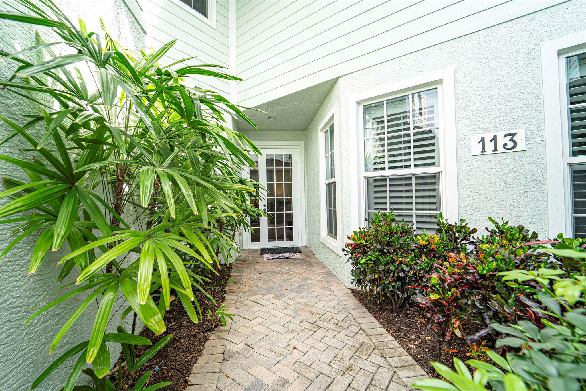 Desirable First Floor Unit! Completely remodeled w/ open floor plan & high ceilings located in the GATED ''Oak Hammock'' side of the exclusive Golf community, Indian River Club. This lovely home has 2 BR 2 BA plus a 3rd BR or Den/Office and a one car Garage. Wood-look flooring throughout, stunning kitchen, stainless steel appliances and marble counter tops. The elevated section of the counter opens to the large living room & beyond that is a Screened Patio overlooking a private Nature Preserve.The Master Bedroom Suite features wood plantation shutters, large walk-in closet & separate tub and walk-in shower plus a double sink vanity. Fully furnished with High End furniture and quality wall art. Hurricane Impact windows throughout!Pickleball courts, heated pool & fitness center.