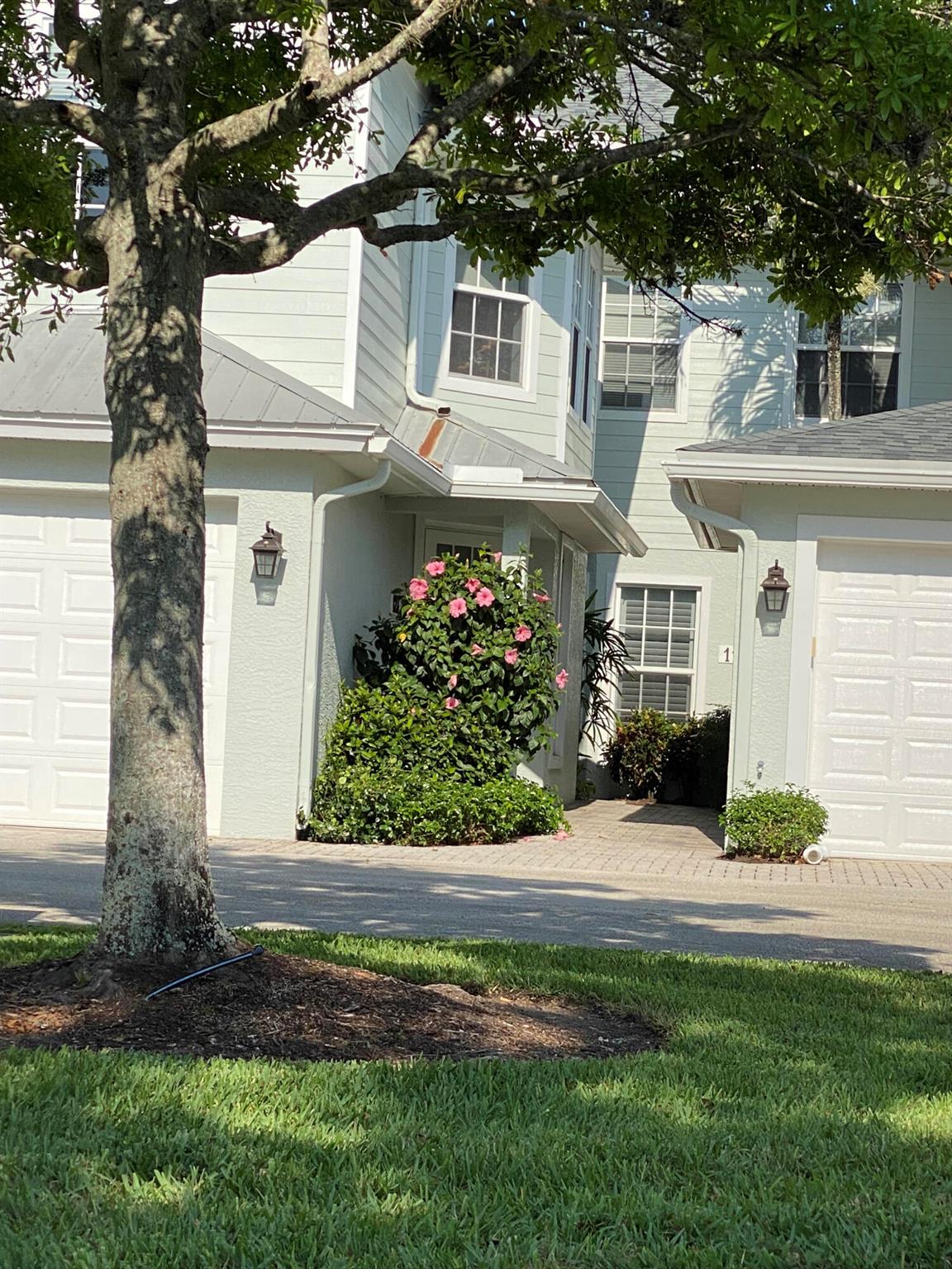 Desirable First Floor Unit! Completely remodeled w/ open floor plan & high ceilings located in the GATED ''Oak Hammock'' side of the exclusive Golf community, Indian River Club. This lovely home has 2 BR 2 BA plus a 3rd BR or Den/Office and a one car Garage. Wood-look flooring throughout, stunning kitchen, stainless steel appliances and marble counter tops. The elevated section of the counter opens to the large living room & beyond that is a Screened Patio overlooking a private Nature Preserve.The Master Bedroom Suite features wood plantation shutters, large walk-in closet & separate tub and walk-in shower plus a double sink vanity. Fully furnished with High End furniture and quality wall art. Hurricane Impact windows throughout! Pickleball courts, heated pool & fitness center.