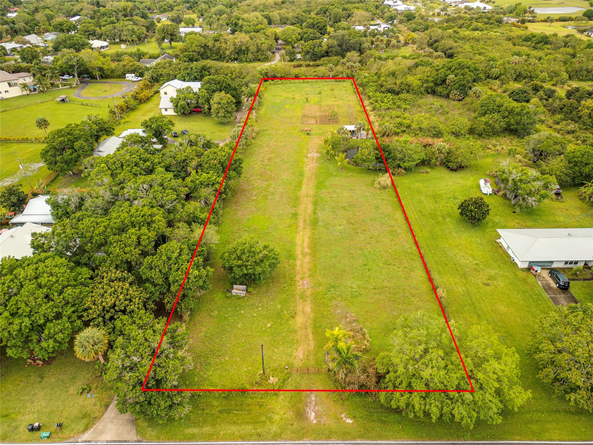 2.16 Acres of Prime Land in White City Estates. Just a few miles from I-95 and Turnpike intersection. Artesian well and pond on the property. This great cleared and filled acreage is ready to build your dream home. Minutes from South Beach, Jetty Park, and Historic Downtown Fort Pierce. Enjoy waterfront dining, and coffee shops. The parcel is zoned AR1.